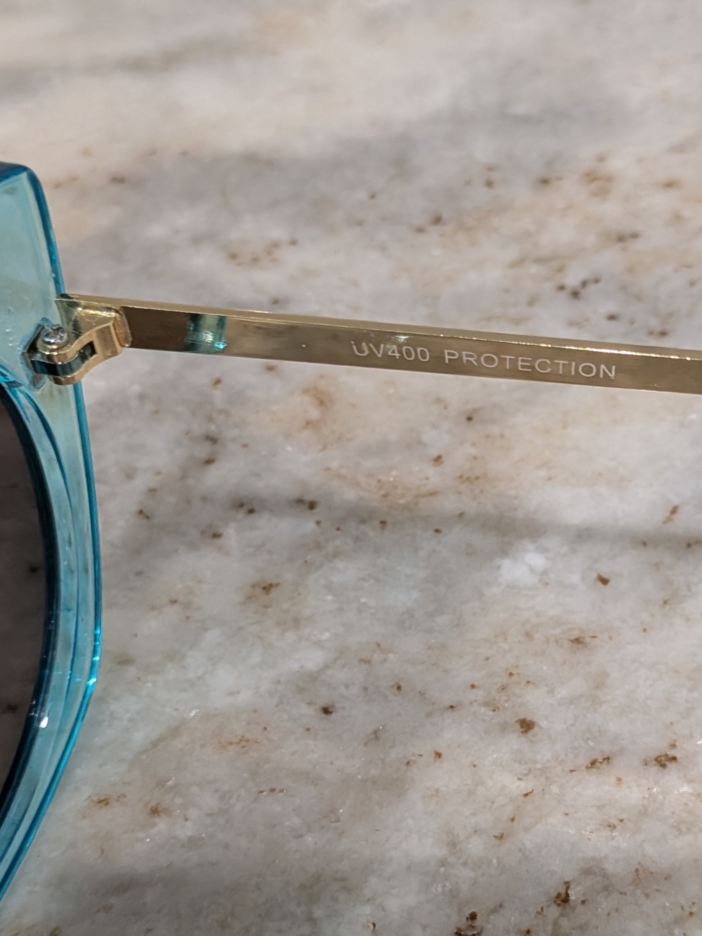 Women’s Teal Transparent Frame Sunglasses with Orange Lenses - Picture 5 of 6